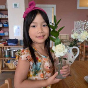 Casa student working with flower arrangement